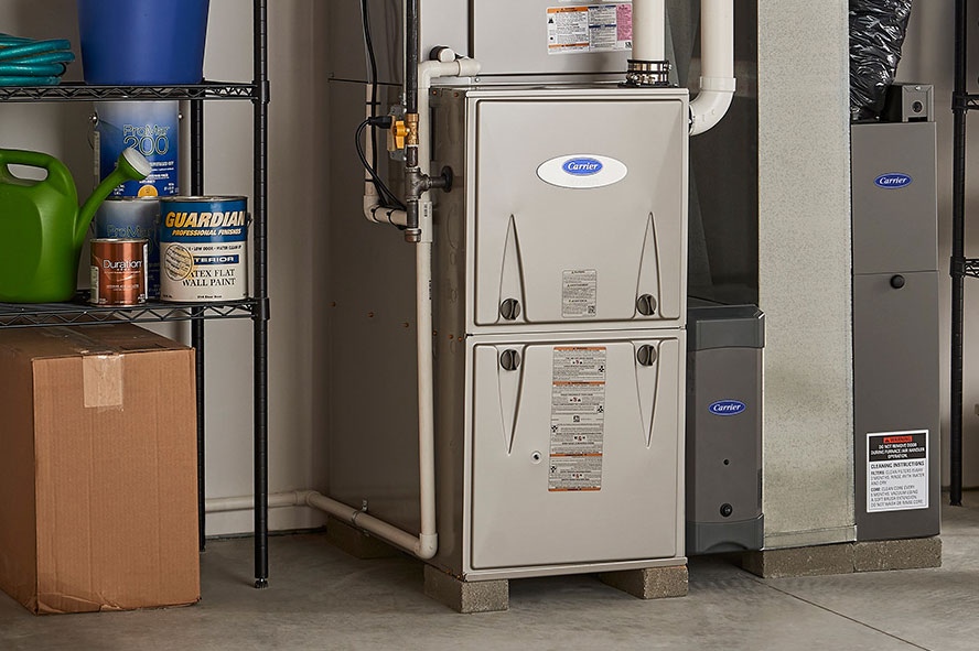 Carrier brand furnace in a furnace room Carrier brand furnace in a furnace room